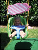 smiling toddler in plastic swing set with Buggy Gear SunChaser blocking the sunlight