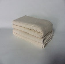 folded Breeze baby prefold diaper on white background