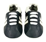 pair of leather shoes for babies in black and white