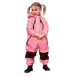 girl in pigtails wearing pink Muddy Buddy waterproof coveralls