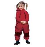 girl in pigtails wearing red Muddy Buddy waterproof coveralls