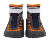 Baby sock shoes with rubber soles in orange in black pattern