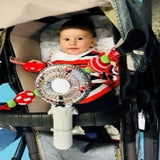 baby in stroller with stroller fan attached to handle